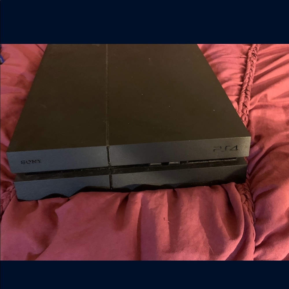PS4 with games and controller